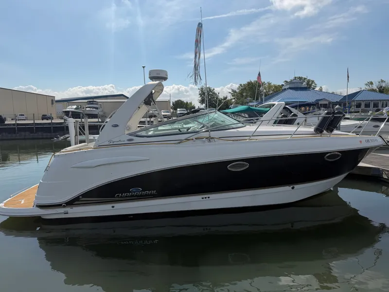 Slide: The Image of 2005 Chaparral 290 Signature boat docked in sunny marina. - 2