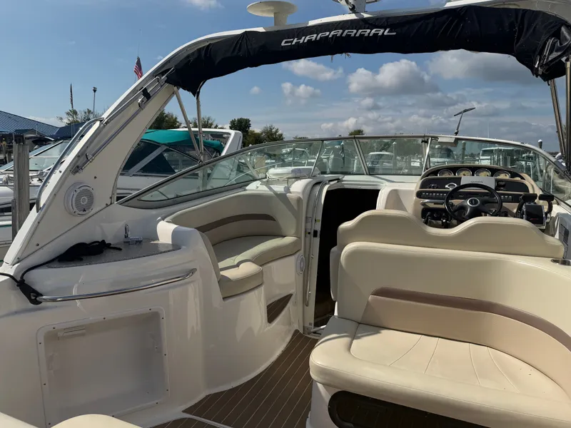 Slide: The Image of 2005 Chaparral 290 Signature boat interior, beige seating, helm station. - 8