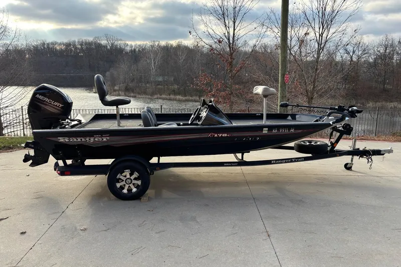 Slide: The Image of 2017 Ranger RT178C fishing boat with Mercury engine, parked near a lake. - 7