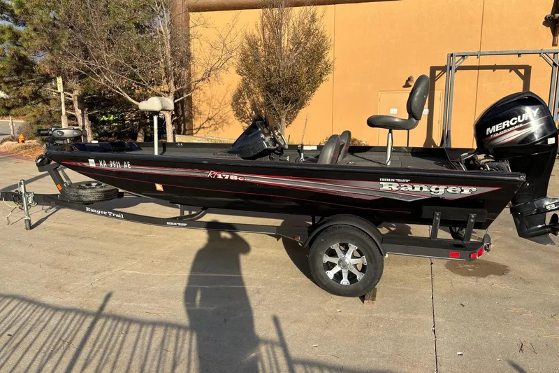 Slide: The Image of 2017 Ranger RT178C fishing boat with Mercury engine on trailer, parked outdoors. - 9
