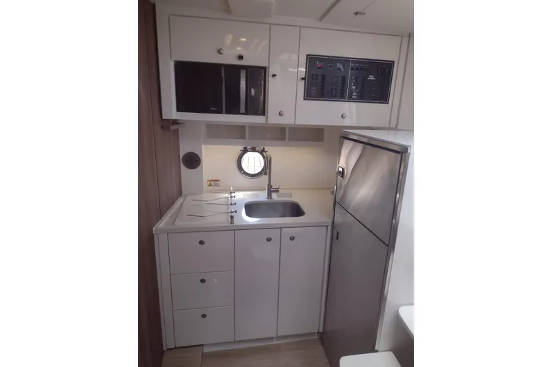 Slide: The Image of Compact kitchen in 2023 Evolve 400HT yacht with modern appliances and sleek design. - 17