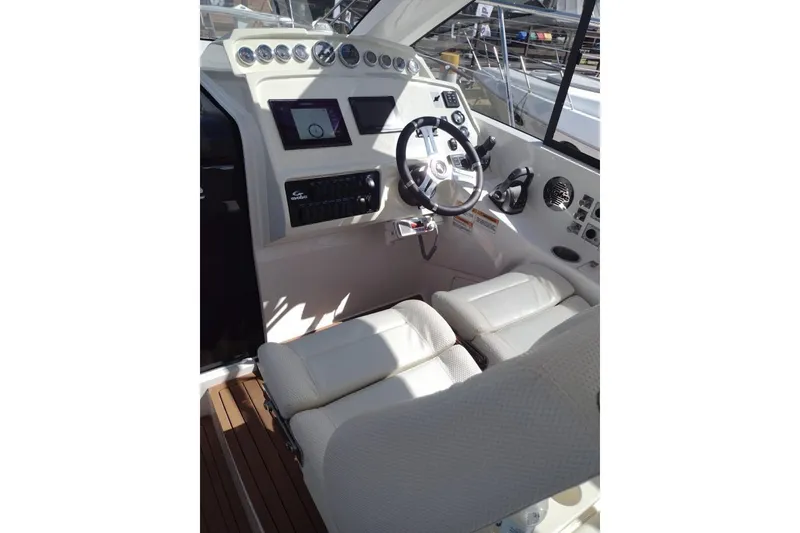 Slide: The Image of 2023 Evolve 400HT yacht cockpit with modern controls and plush seating. - 21