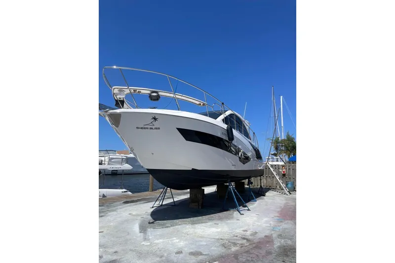 Slide: The Image of 2023 Evolve 400HT yacht on dry dock under clear blue sky. - 4