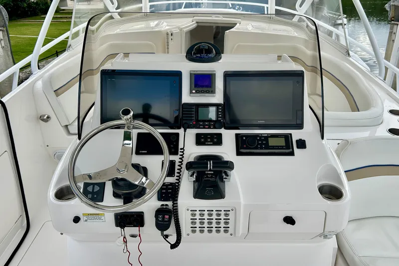 Slide: The Image of Cockpit of 2012 Intrepid 400 Cuddy with advanced navigation and control systems. - 18