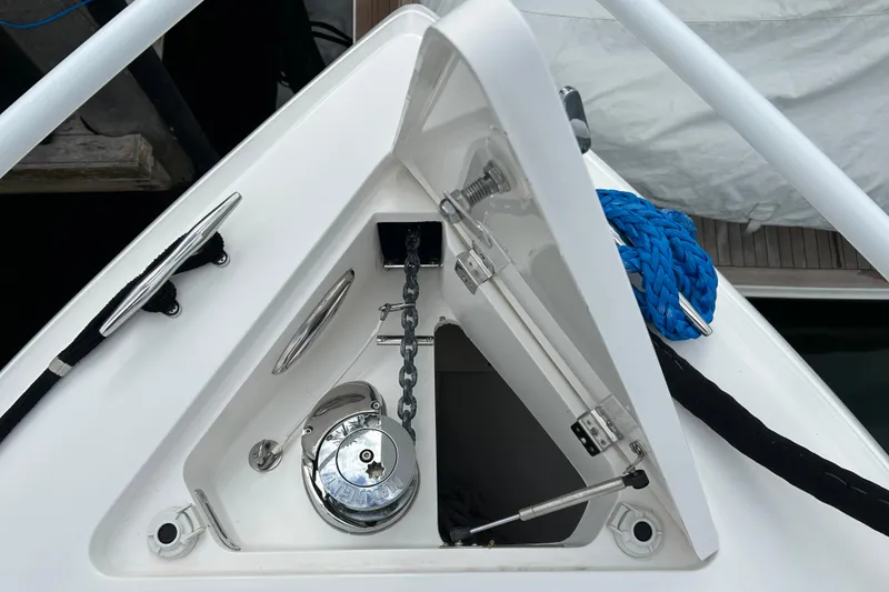 Slide: The Image of 2012 Intrepid 400 Cuddy anchor locker with chain and blue rope. - 40