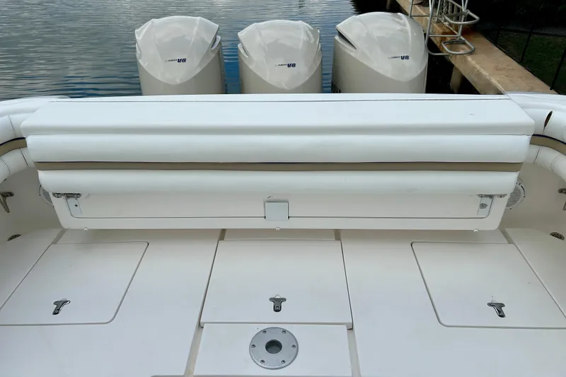 Slide: The Image of 2012 Intrepid 400 Cuddy boat with Yamaha engines, featuring a spacious deck layout. - 7