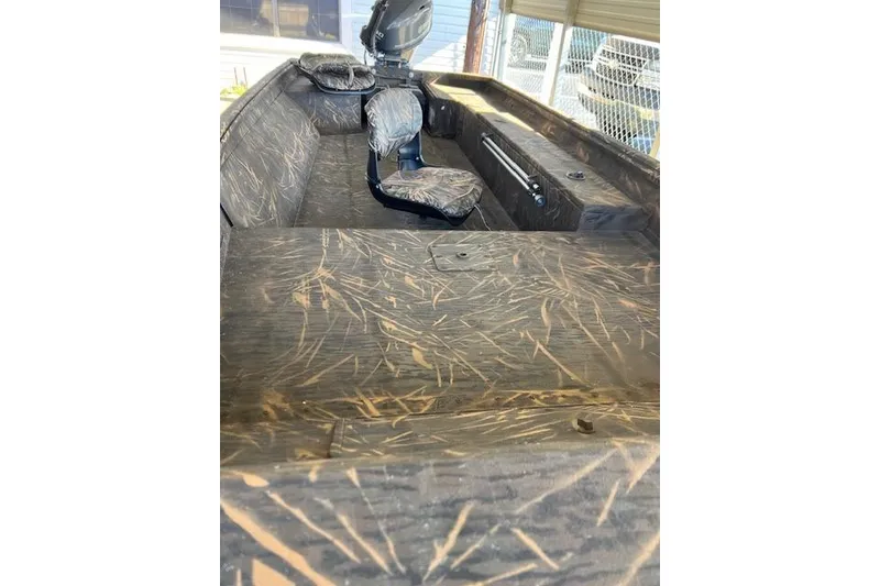 The Image of 2025 G3 Gator Tough 16 DK boat interior with camouflage seating and flooring. - 1