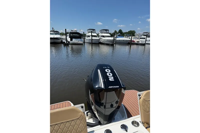 Slide: The Image of 2024 Trophy CC22 boat with Mercury 200 V6 engine at marina dock. - 10