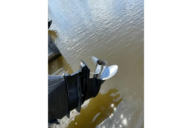 Slide: The Image of Outboard motor propeller of 2024 Trophy CC22 boat on water. - 7