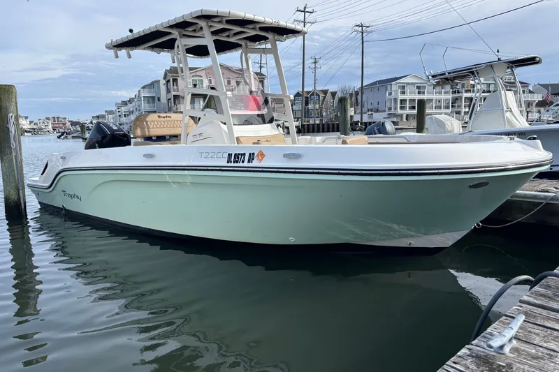 The Image of 2024 Trophy CC22 boat docked in a marina, showcasing sleek design and modern features. - 1