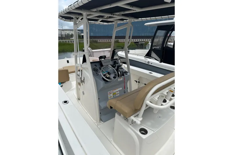 Slide: The Image of 2024 Trophy CC22 boat interior with steering console and seating. - 2