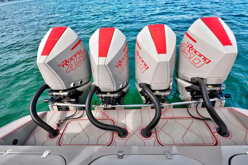 Slide: The Image of Four powerful Racing 450 outboard engines on a 2023 Midnight Express 43 Open boat. - 12