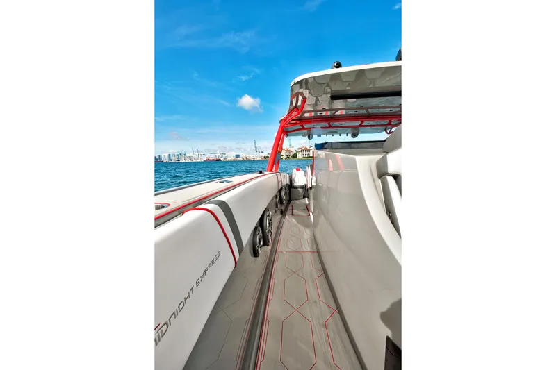 Slide: The Image of 2023 Midnight Express 43 Open boat on water, showcasing sleek design and vibrant accents. - 13
