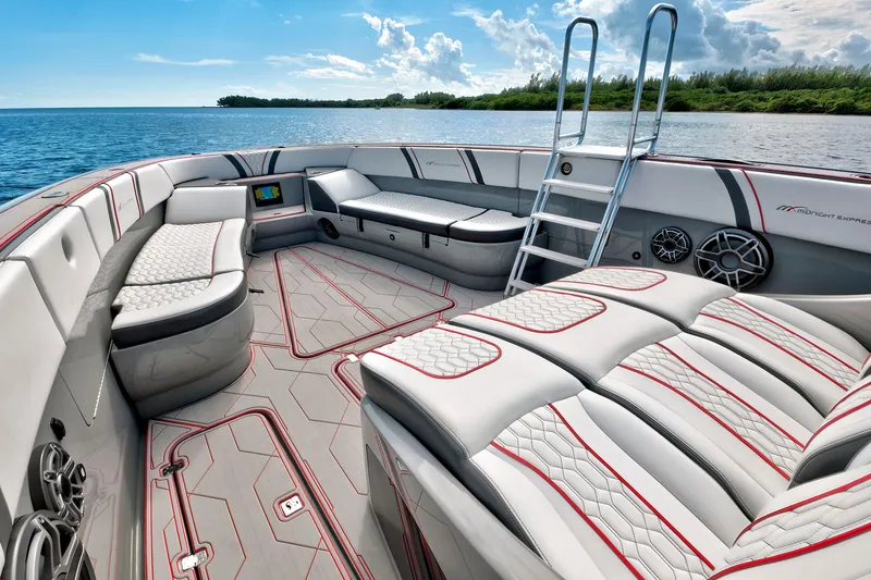 Slide: The Image of Luxurious 2023 Midnight Express 43 Open boat interior with plush seating and scenic ocean view. - 17