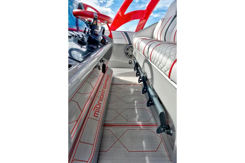Slide: The Image of Interior of 2023 Midnight Express 43 Open boat with sleek design and red accents. - 22
