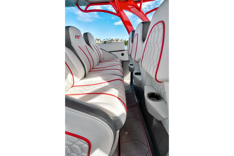 Slide: The Image of Luxurious interior of 2023 Midnight Express 43 Open boat with stylish seating and red accents. - 27