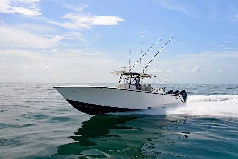 The Image of 2023 SeaVee 370Z boat cruising on open water under a clear sky. - 0