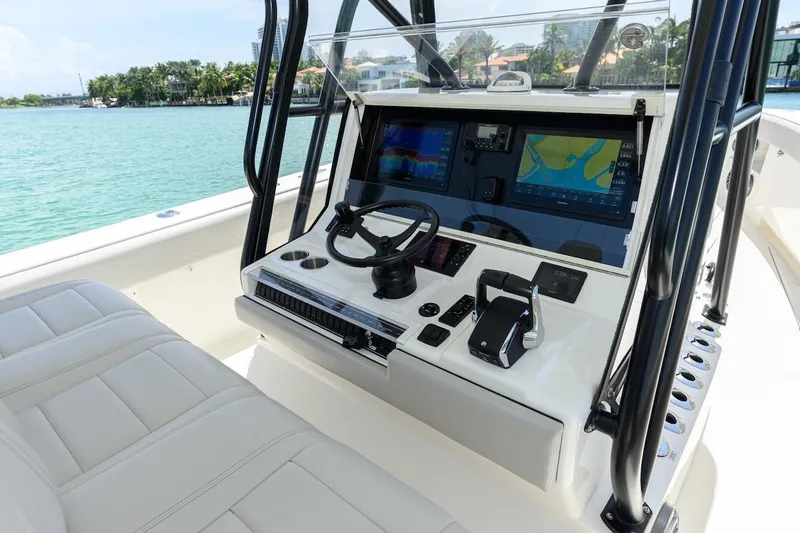 Slide: The Image of 2023 SeaVee 370Z boat console with advanced navigation displays and controls. - 11
