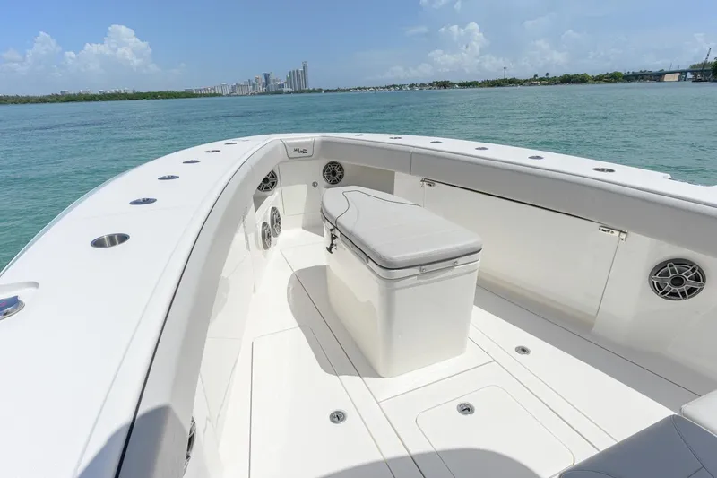 Slide: The Image of 2023 SeaVee 370Z boat deck with seating, speakers, and ocean view. - 16