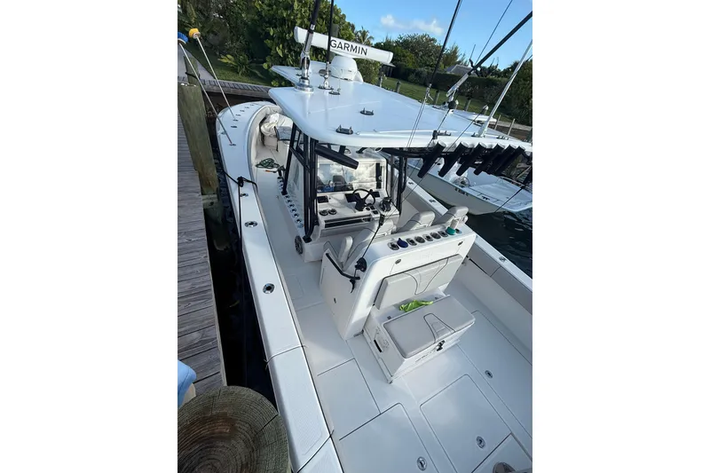 Slide: The Image of 2023 SeaVee 370Z boat docked, featuring a sleek design and advanced navigation equipment. - 22