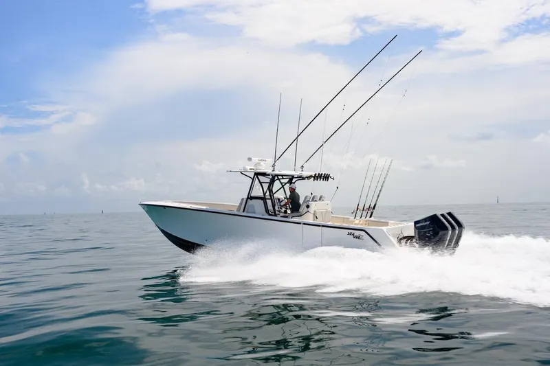 Slide: The Image of 2023 SeaVee 370Z boat cruising on open water under a clear sky. - 3