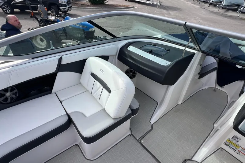 Slide: The Image of 2020 Regal 21 OBX boat interior with white seating and modern dashboard design. - 5