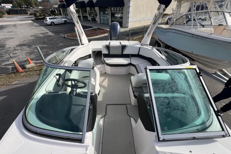 Slide: The Image of 2020 Regal 21 OBX boat with open bow seating and modern interior design. - 7