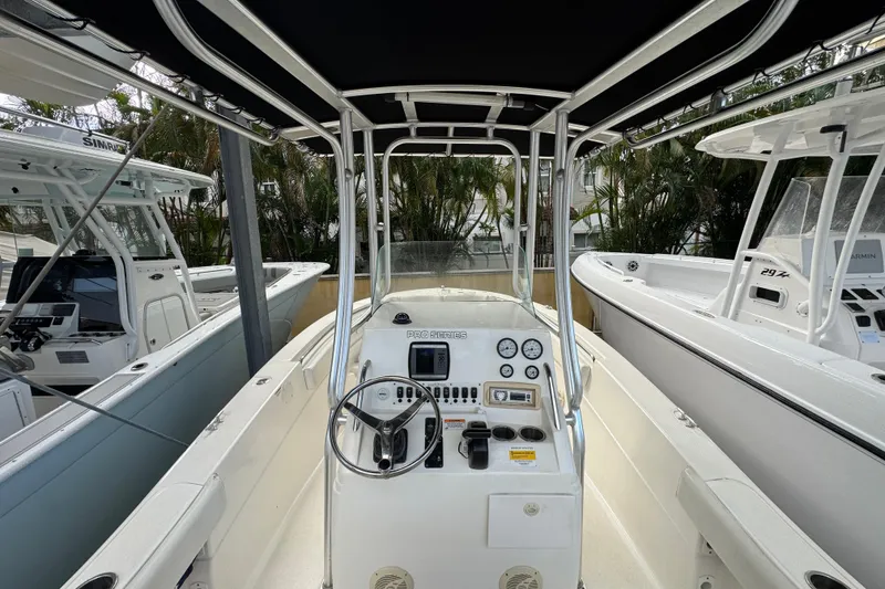 Slide: The Image of 2011 Sea Fox 226 Center Console boat interior with steering wheel and control panel. - 11