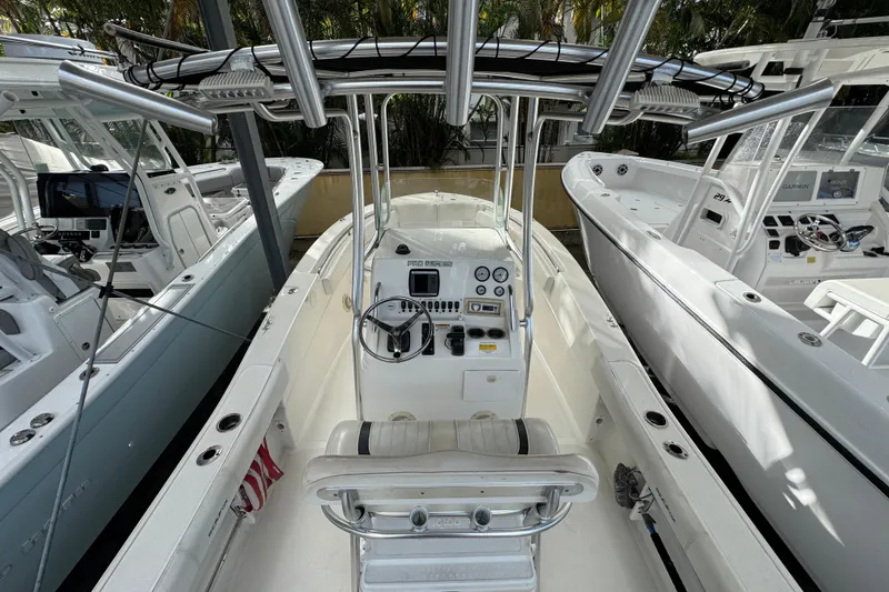 Slide: The Image of 2011 Sea Fox 226 Center Console boat with steering wheel and control panel. - 12