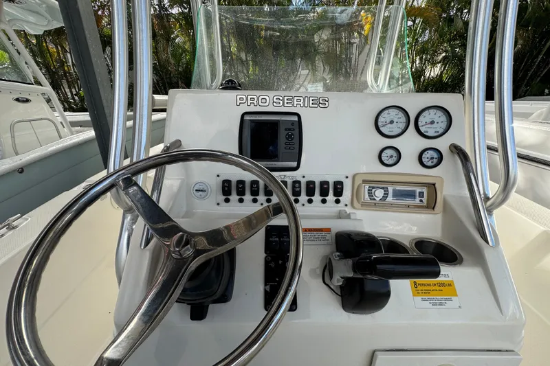 Slide: The Image of 2011 Sea Fox 226 Center Console dashboard with steering wheel and gauges. - 14