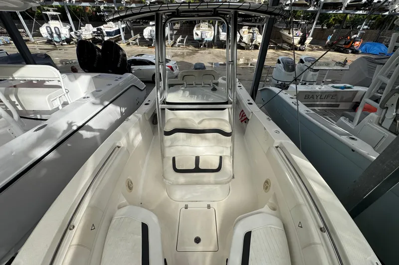 Slide: The Image of 2011 Sea Fox 226 Center Console boat interior with seating and console view. - 16