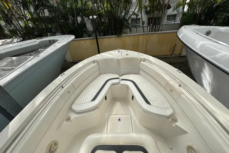 Slide: The Image of 2011 Sea Fox 226 Center Console boat interior with white seating and sleek design. - 17