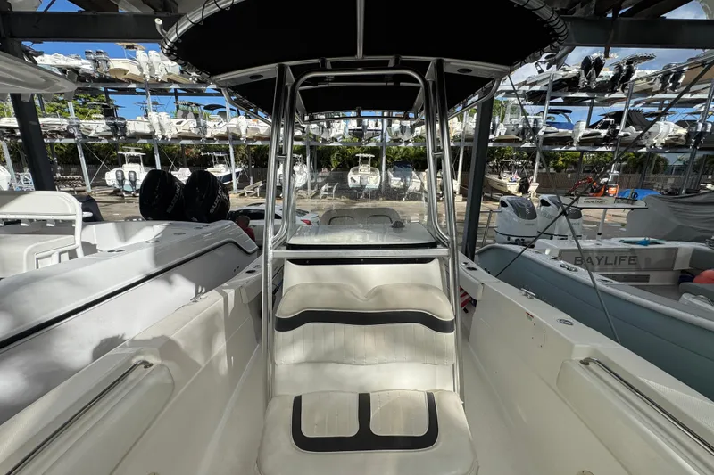 Slide: The Image of 2011 Sea Fox 226 Center Console boat in storage, surrounded by other boats. - 23