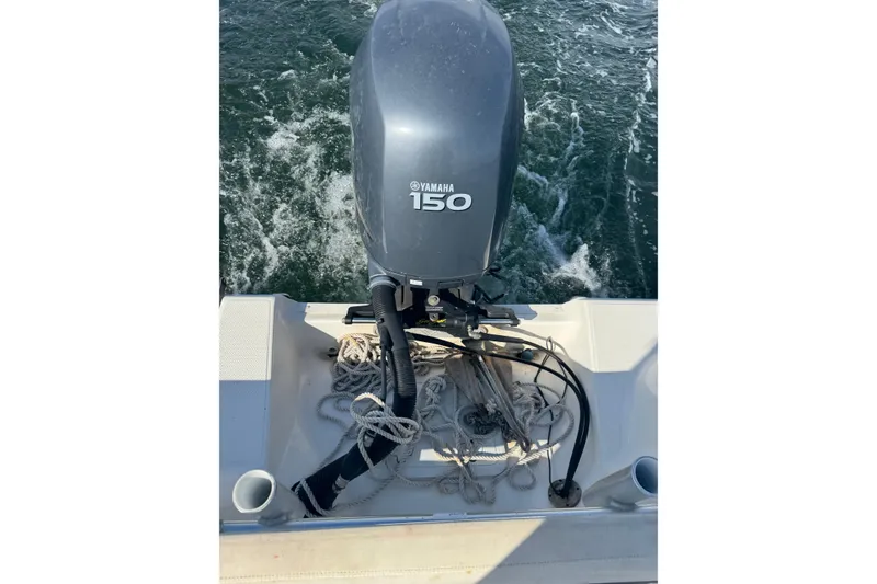 Slide: The Image of Yamaha 150 outboard motor on 2011 Sea Fox 226 Center Console boat, with ropes and water. - 31