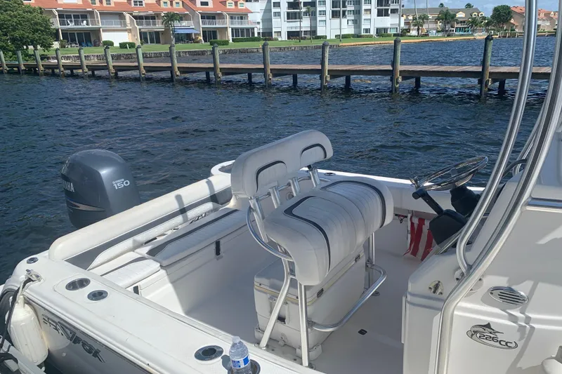 Slide: The Image of 2011 Sea Fox 226 Center Console boat docked by waterfront homes. - 6