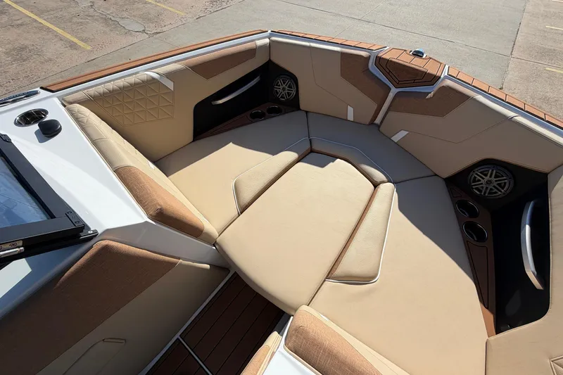 Slide: The Image of Luxurious interior of 2026 Nautique Super Air Nautique GS22 boat with plush seating. - 14