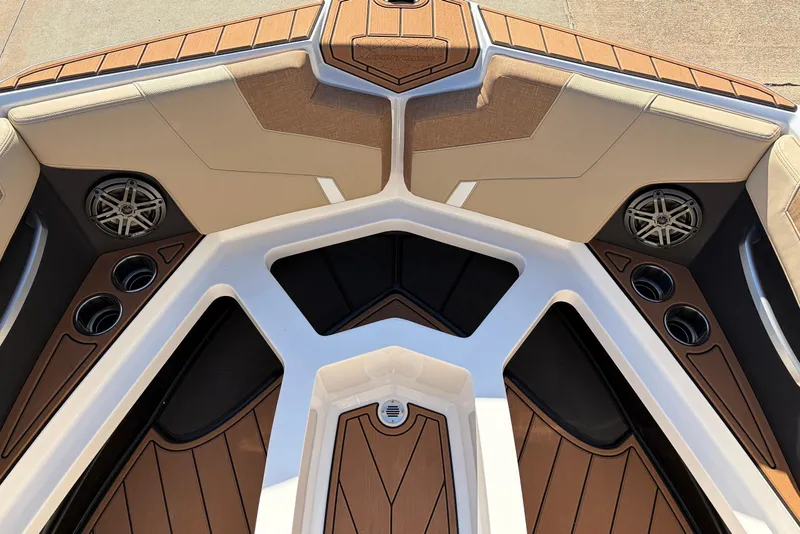 Slide: The Image of 2026 Nautique Super Air Nautique GS22 boat interior with speakers and cup holders. - 22