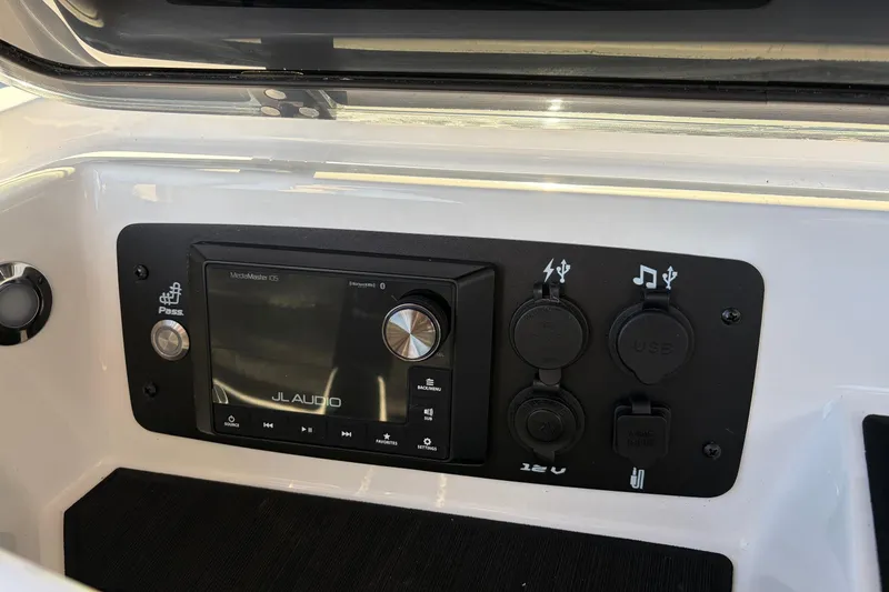 Slide: The Image of Control panel of 2026 Nautique Super Air Nautique GS22 with JL Audio system. - 29