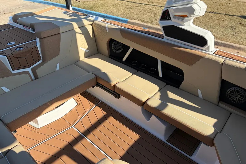 Slide: The Image of 2026 Nautique Super Air Nautique GS22 interior with tan seating and modern design. - 31