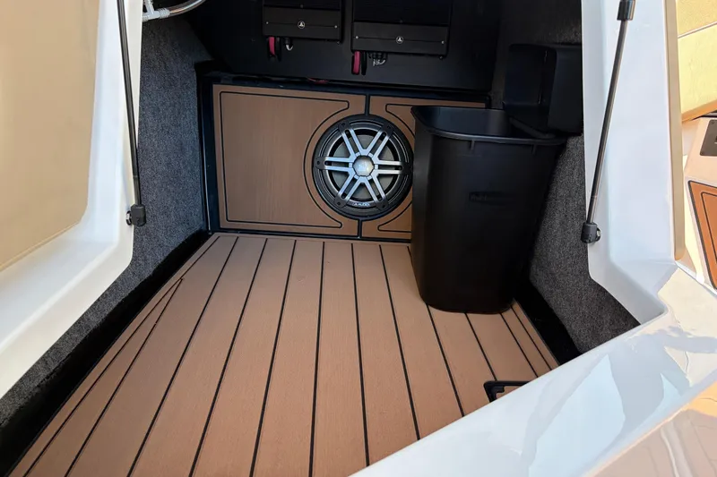 Slide: The Image of 2026 Nautique Super Air Nautique GS22 interior with speaker and storage area. - 33