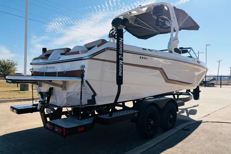 Slide: The Image of 2026 Nautique Super Air Nautique GS22 boat on trailer, parked outdoors. - 5