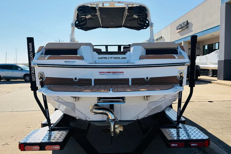 Slide: The Image of 2026 Nautique Super Air Nautique GS22 boat on trailer, rear view. - 6