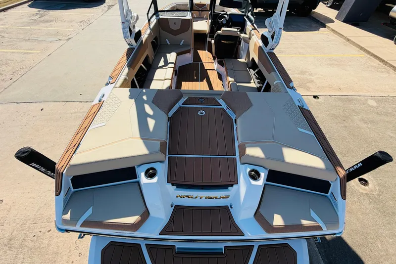 Slide: The Image of 2026 Nautique Super Air Nautique GS22 boat interior with luxurious seating and sleek design. - 9