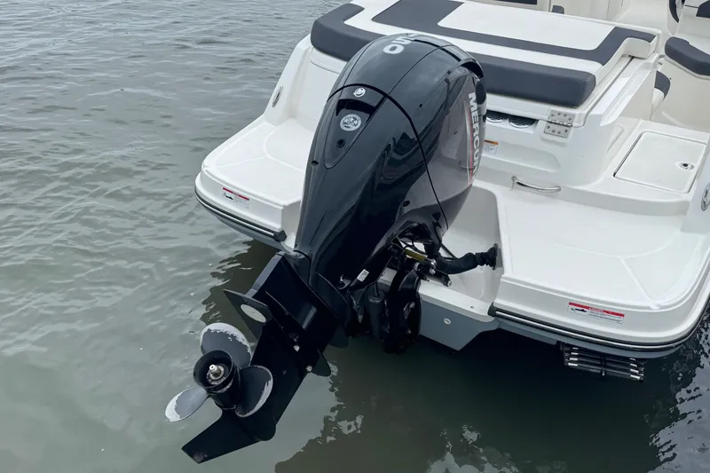 Slide: The Image of 2024 Bayliner VR6 Bowrider OB with Mercury outboard engine on water. - 7