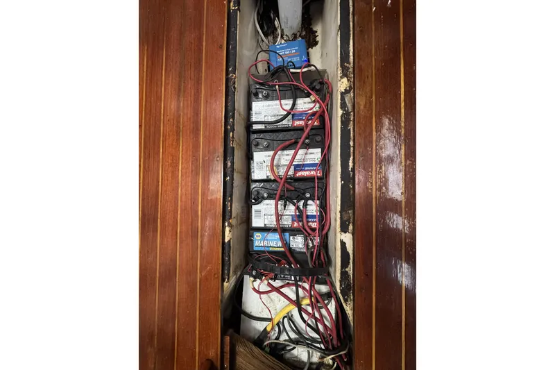 Slide: The Image of Electrical wiring and batteries inside a 1987 Irwin 38 sailboat. - 27