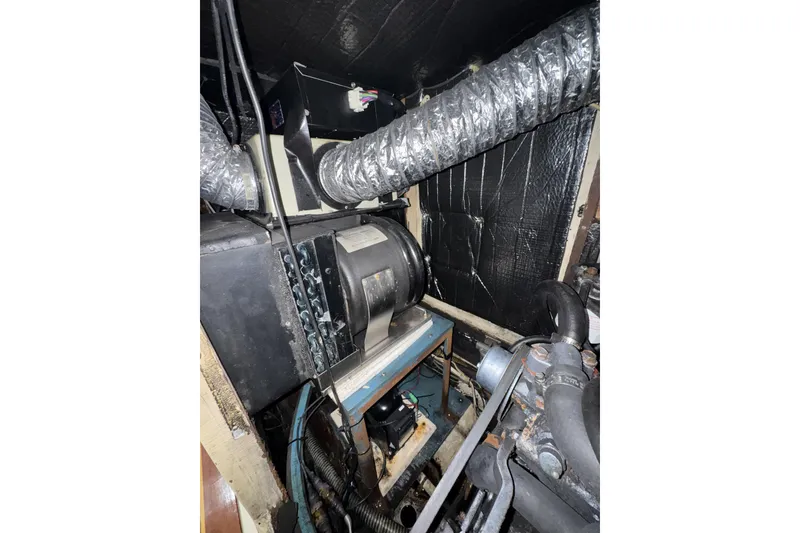 Slide: The Image of Engine room of a 1987 Irwin 38 sailboat with ventilation system and machinery. - 30