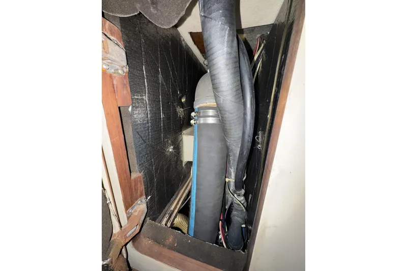 Slide: The Image of Interior view of 1987 Irwin 38 sailboat showing plumbing and wiring components. - 34