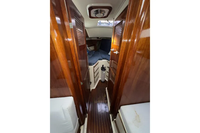 Slide: The Image of Interior of 1987 Irwin 38 sailboat with polished wood finish and cozy cabin. - 35