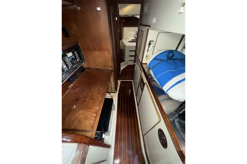 Slide: The Image of Interior of 1987 Irwin 38 sailboat with wooden cabinetry and nautical equipment. - 39