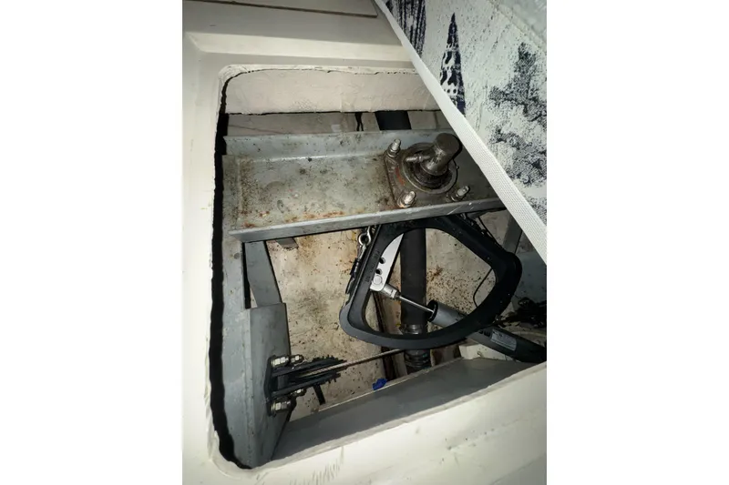 Slide: The Image of 1987 Irwin 38 boat interior showing mechanical components and steering system. - 48